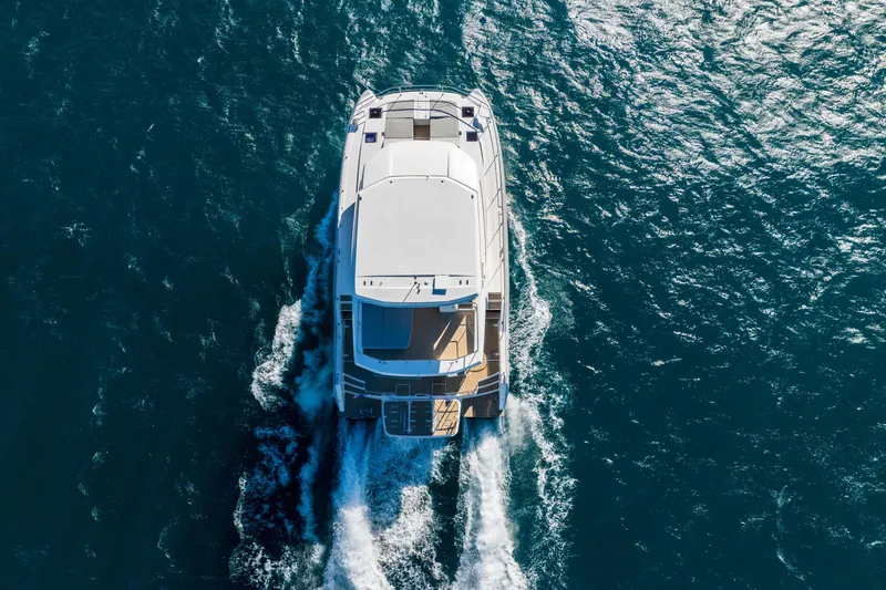 Slide: The Image of Aerial view of 2021 Leopard 53 Powercat cruising on open water. - 7