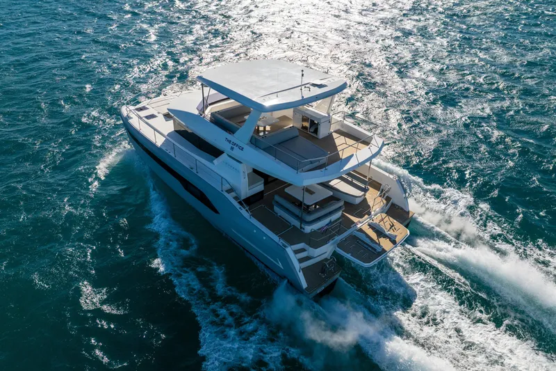 Slide: The Image of Aerial view of 2021 Leopard 53 Powercat yacht cruising on open sea. - 8