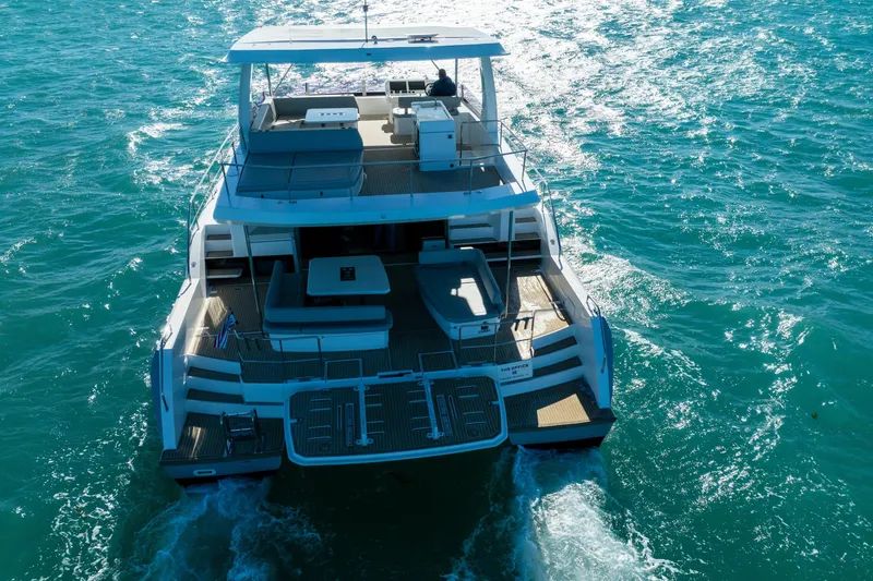 Slide: The Image of Aerial view of 2021 Leopard 53 Powercat yacht cruising on blue ocean waters. - 9