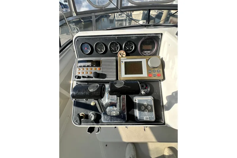 Slide: The Image of Control panel of a 1995 Carver 440 Aft Cabin Motor Yacht with navigation instruments. - 28