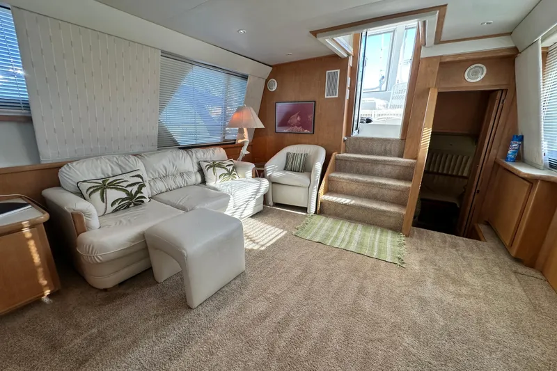 Slide: The Image of Luxurious interior of 1995 Carver 440 Aft Cabin Motor Yacht with plush seating and elegant decor. - 38