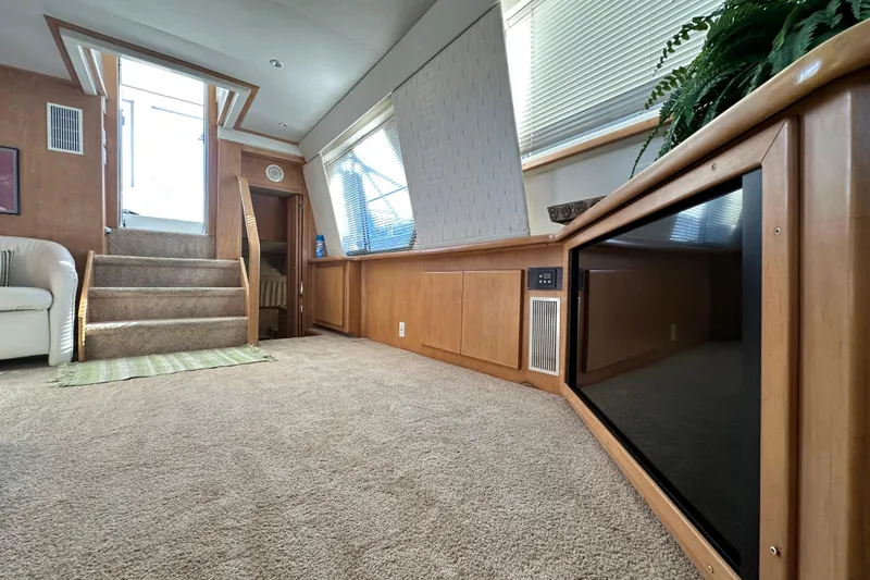 Slide: The Image of Interior of 1995 Carver 440 Aft Cabin Motor Yacht with carpeted stairs and modern decor. - 43