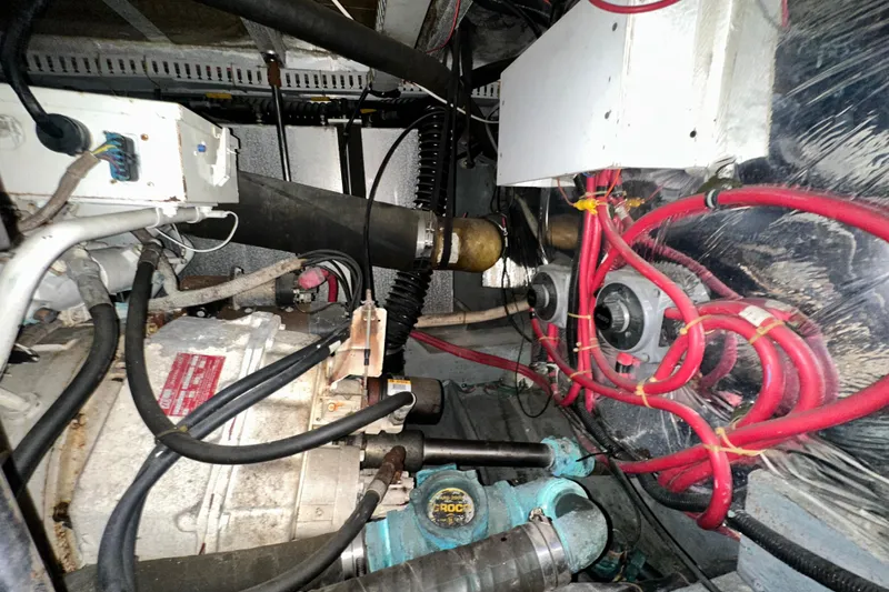 Slide: The Image of Engine room of 1995 Carver 440 Aft Cabin Motor Yacht with visible wiring and components. - 82