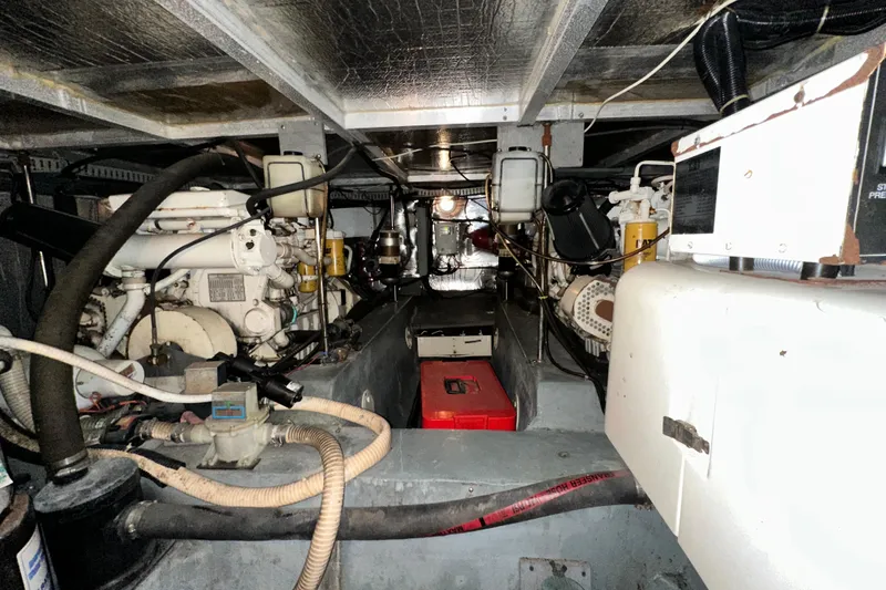 Slide: The Image of Engine room of 1995 Carver 440 Aft Cabin Motor Yacht, showcasing mechanical components. - 87