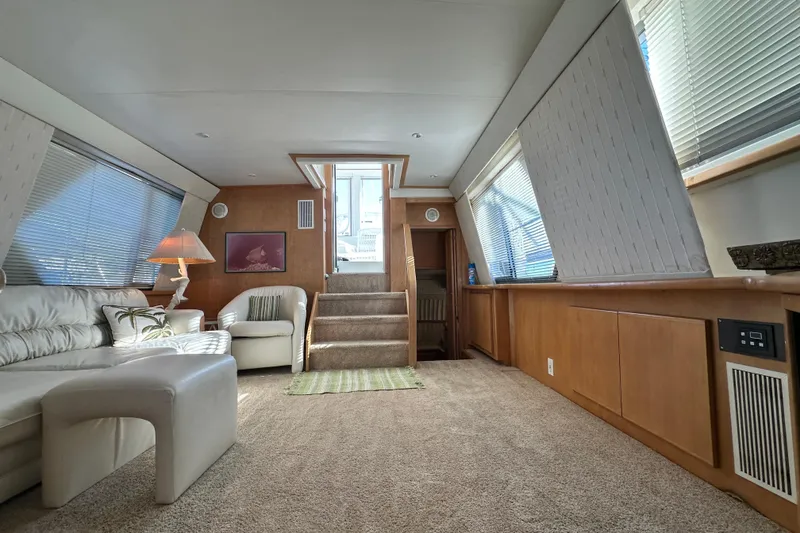 Slide: The Image of Luxurious interior of 1995 Carver 440 Aft Cabin Motor Yacht with plush seating and elegant decor. - 41