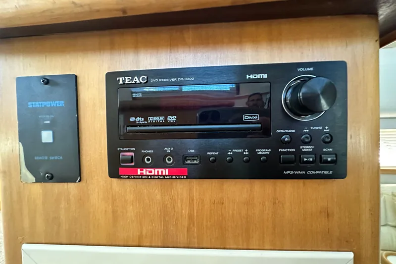 Slide: The Image of TEAC DVD receiver and remote switch in 1995 Carver 440 Aft Cabin Motor Yacht. - 44