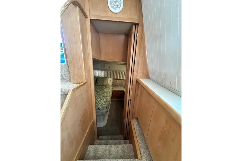 Slide: The Image of Stairway leading to cozy cabin in 1995 Carver 440 Aft Cabin Motor Yacht. - 57