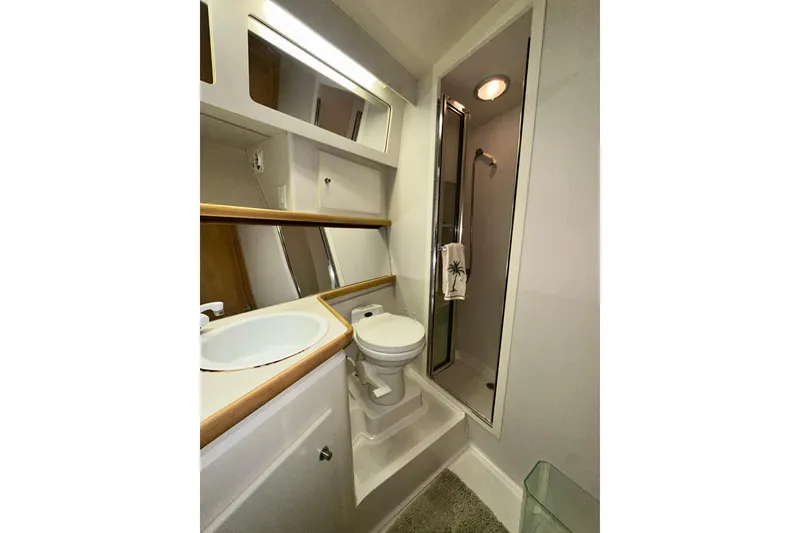 Slide: The Image of Bathroom of 1995 Carver 440 Aft Cabin Motor Yacht with shower and sink. - 63