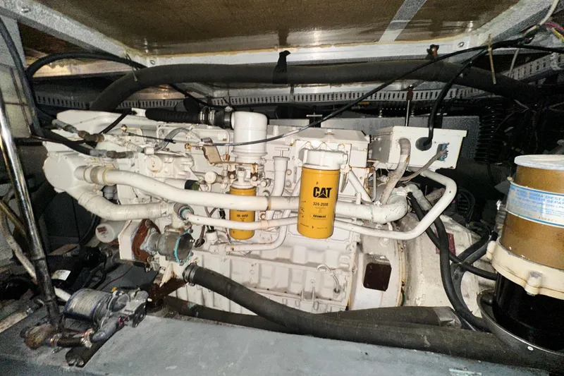 Slide: The Image of Engine compartment of a 1995 Carver 440 Aft Cabin Motor Yacht, featuring CAT components. - 84