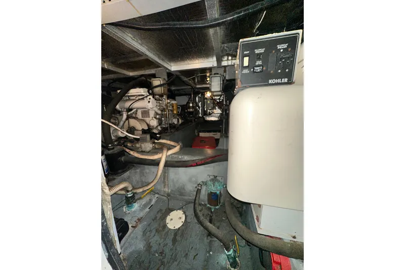 Slide: The Image of Engine room of 1995 Carver 440 Aft Cabin Motor Yacht with Kohler generator. - 88