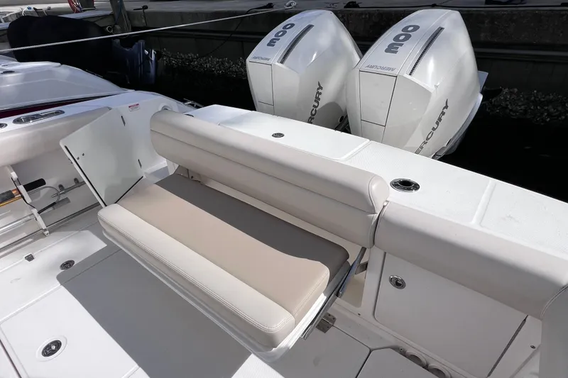 Slide: The Image of 2021 Boston Whaler 330 Outrage boat with dual Mercury engines and foldable seating. - 18