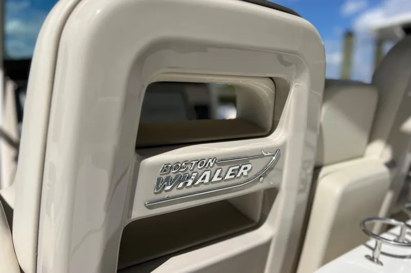 Slide: The Image of 2021 Boston Whaler 330 Outrage boat interior detail with logo. - 29