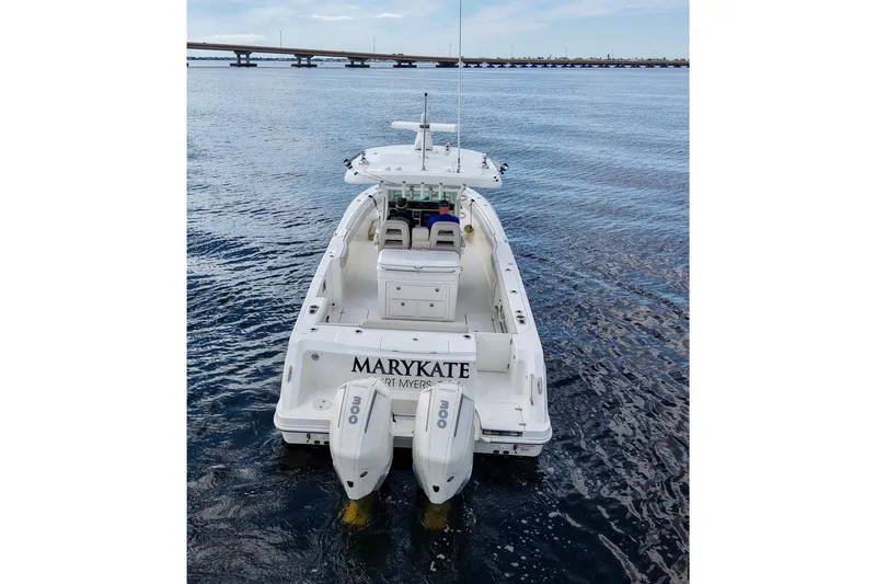 Slide: The Image of Boston Whaler 330 Outrage 2021 boat on water, rear view with twin engines. - 3