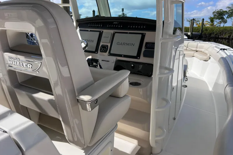 Slide: The Image of 2021 Boston Whaler 330 Outrage boat interior with Garmin navigation system. - 30