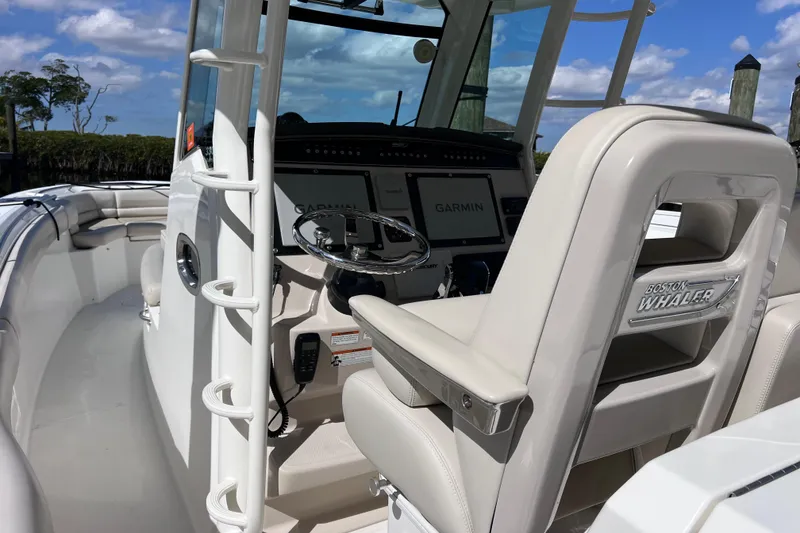 Slide: The Image of 2021 Boston Whaler 330 Outrage boat interior with Garmin navigation system. - 31