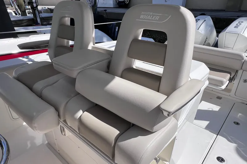 Slide: The Image of 2021 Boston Whaler 330 Outrage boat seats with armrests and logo detailing. - 33