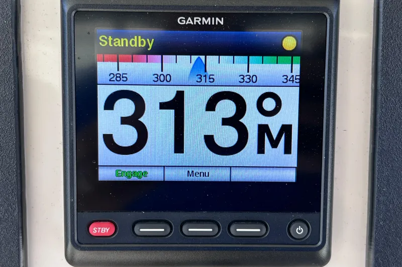 Slide: The Image of Garmin display on 2021 Boston Whaler 330 Outrage showing 313° heading in standby mode. - 40