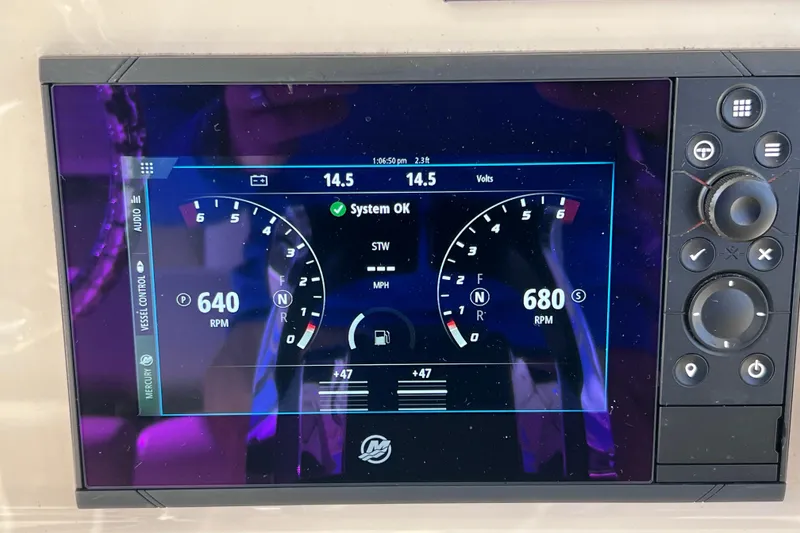 Slide: The Image of 2021 Boston Whaler 330 Outrage dashboard display showing RPM and system status. - 42