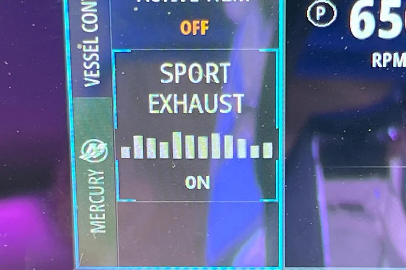 Slide: The Image of Control panel of 2021 Boston Whaler 330 Outrage showing sport exhaust settings. - 43