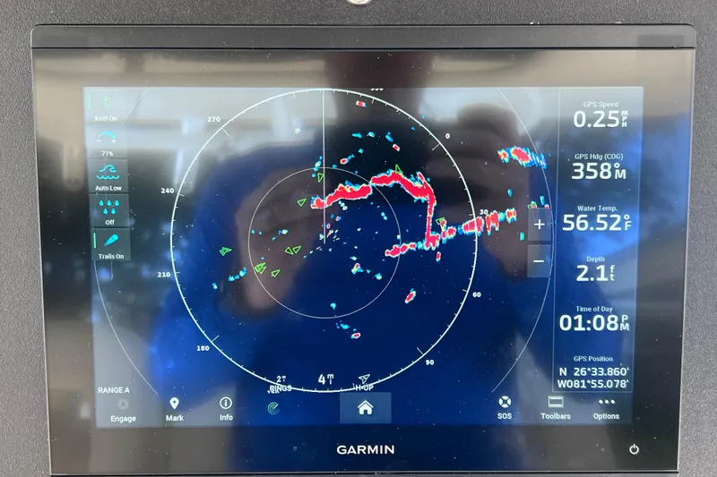 Slide: The Image of Garmin marine radar display on 2021 Boston Whaler 330 Outrage, showing navigation data. - 45