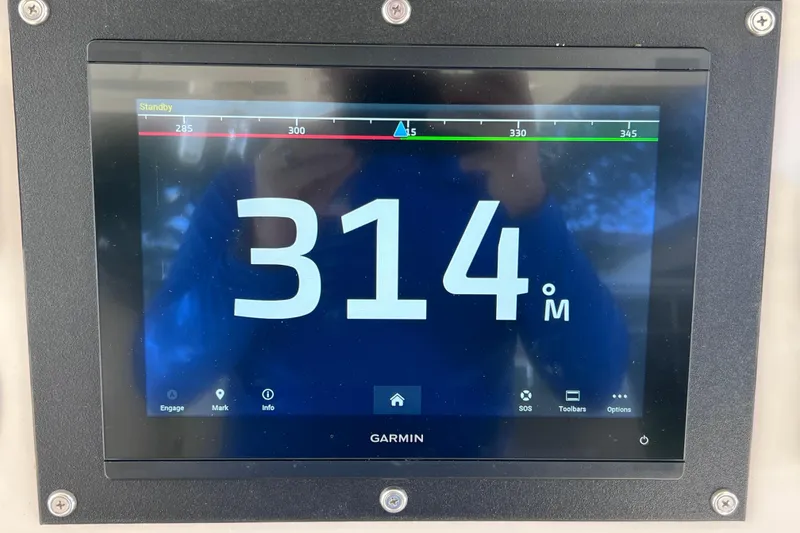 Slide: The Image of Garmin display on 2021 Boston Whaler 330 Outrage showing 314 meters. - 48