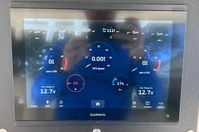Slide: The Image of Garmin display on 2021 Boston Whaler 330 Outrage showing engine metrics and GPS speed. - 49