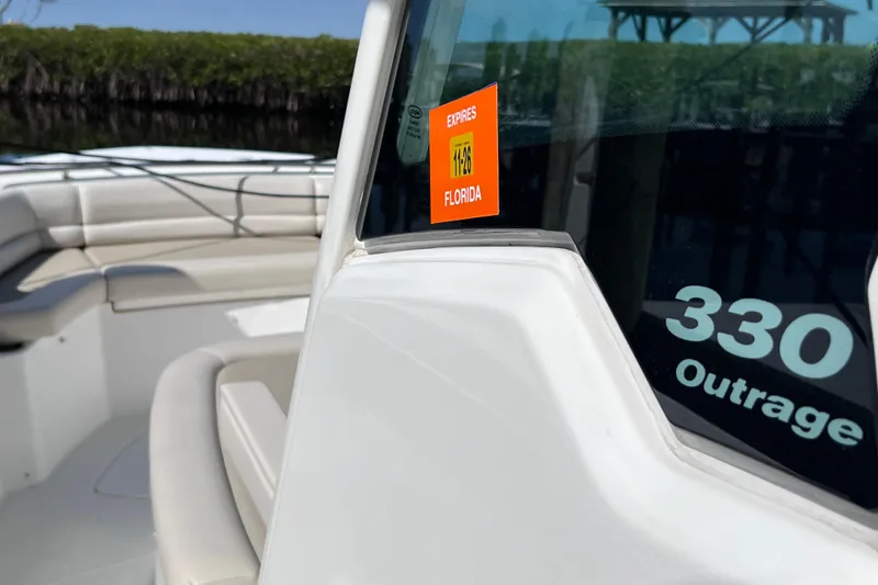 Slide: The Image of 2021 Boston Whaler 330 Outrage boat with Florida registration sticker. - 51