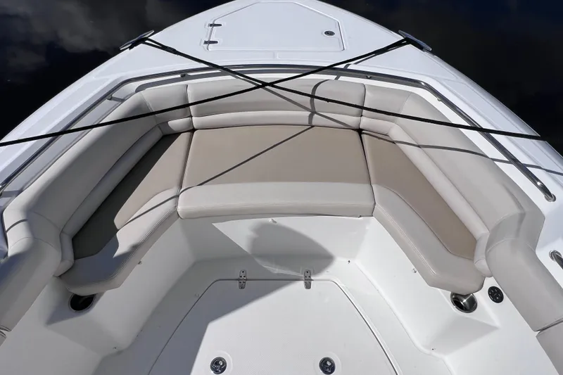 Slide: The Image of 2021 Boston Whaler 330 Outrage boat with cushioned seating and sleek design. - 55