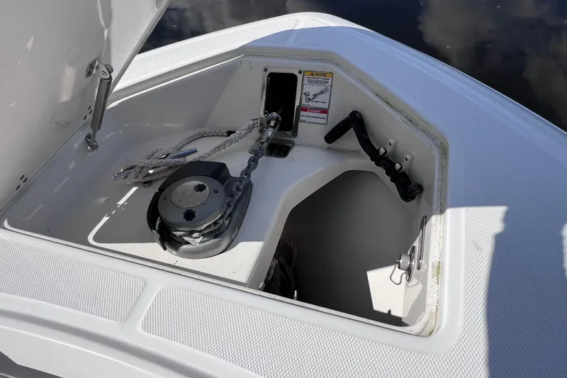 Slide: The Image of Anchor storage compartment on a 2021 Boston Whaler 330 Outrage boat. - 57