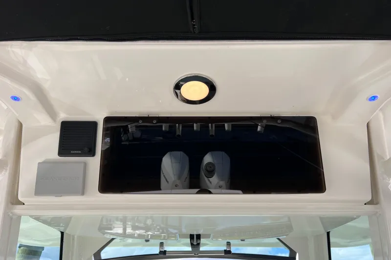 Slide: The Image of 2021 Boston Whaler 330 Outrage dashboard with Garmin and Seakeeper equipment. - 72