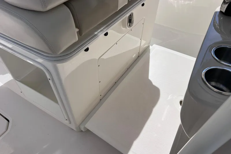 Slide: The Image of 2021 Boston Whaler 330 Outrage interior with seating and cup holders. - 84