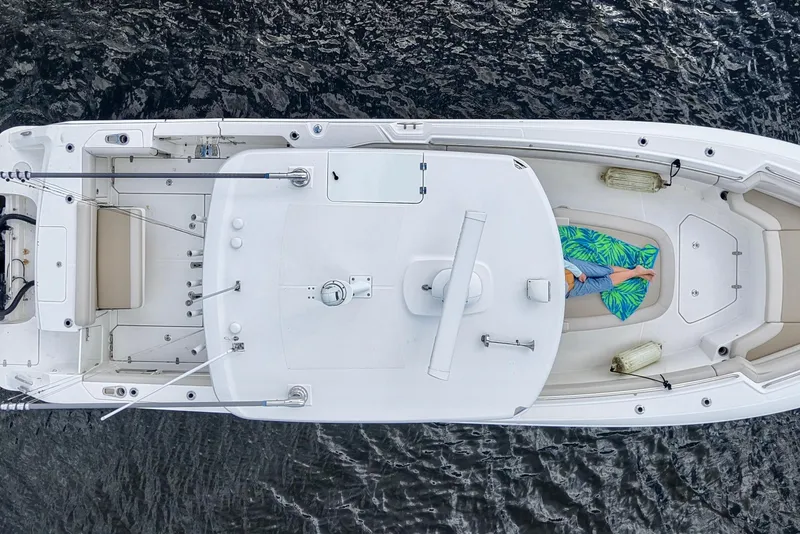 Slide: The Image of Aerial view of a 2021 Boston Whaler 330 Outrage on the water. - 9