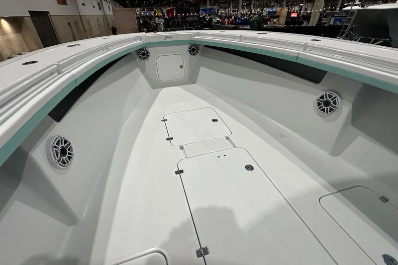 Slide: The Image of 2024 Yellowfin 36 Offshore boat interior with spacious deck and built-in speakers. - 12