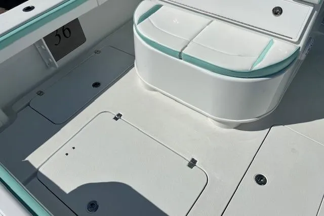 Slide: The Image of 2024 Yellowfin 36 Offshore boat deck with storage compartments and seating. - 22