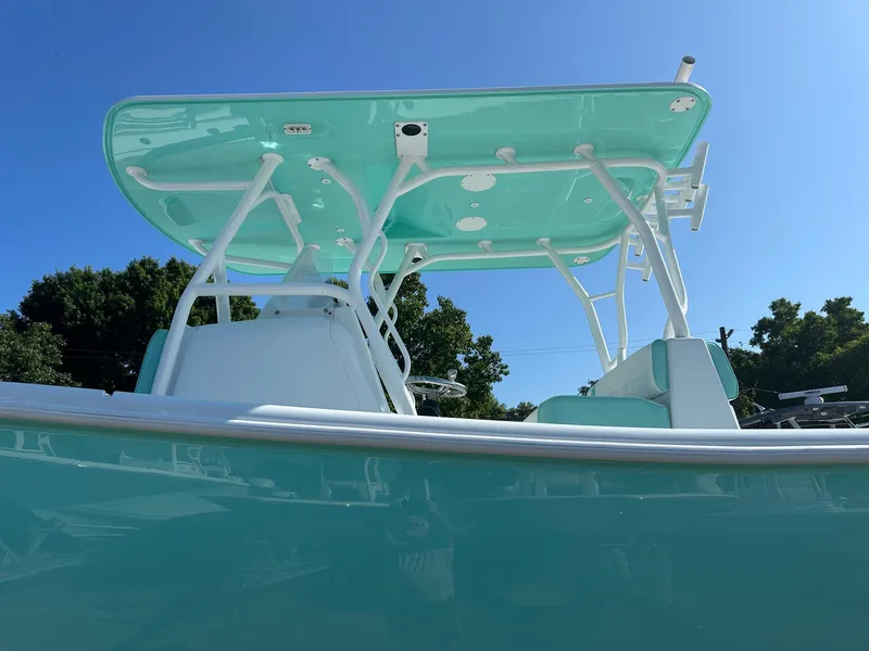 Slide: The Image of 2024 Yellowfin 36 Offshore boat with teal accents and T-top. - 5