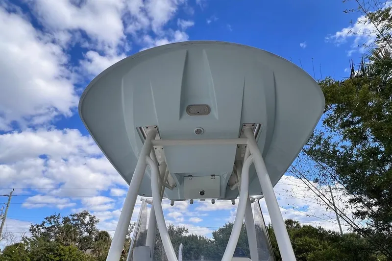 Slide: The Image of 2015 Pathfinder 2600 HPS boat underside against blue sky and clouds. - 18