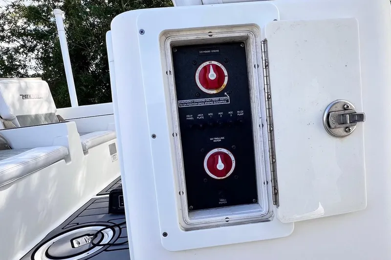 Slide: The Image of Control panel on a 2015 Pathfinder 2600 HPS boat, featuring switches and seating. - 24
