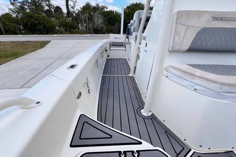 Slide: The Image of 2015 Pathfinder 2600 HPS boat interior with sleek seating and modern design. - 16