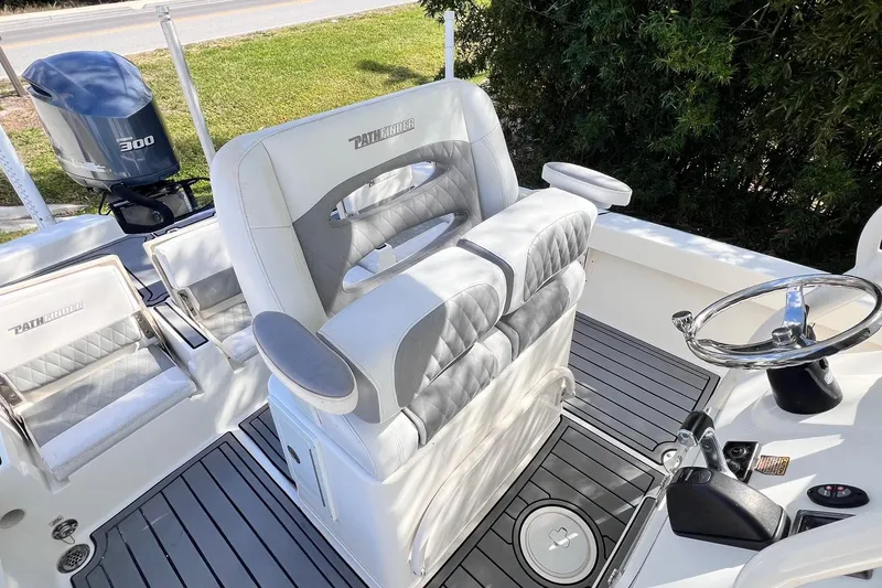 Slide: The Image of 2015 Pathfinder 2600 HPS boat interior with steering wheel and seating. - 25