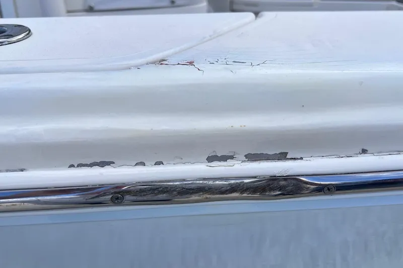 Slide: The Image of 2015 Pathfinder 2600 HPS boat showing paint chipping and surface wear. - 26