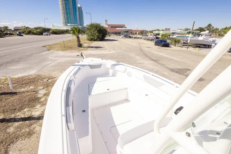Slide: The Image of 2016 Everglades 243 Center Console boat interior with steering wheel and seating. - 14