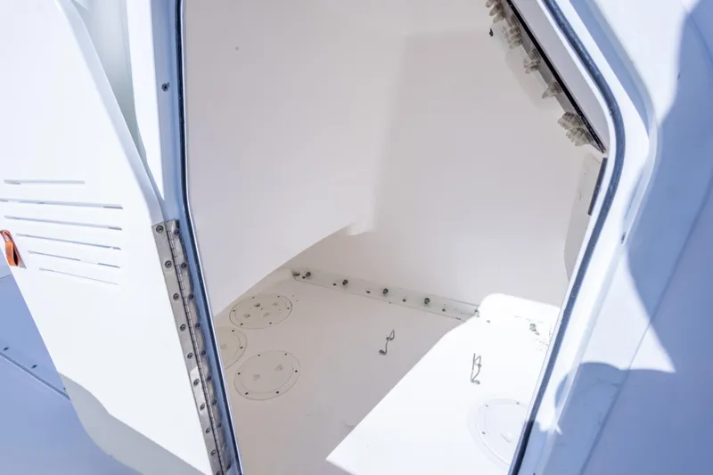 Slide: The Image of 2016 Everglades 243 Center Console boat with Yamaha outboard engine, docked outdoors. - 19