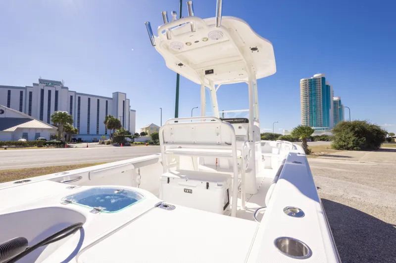 Slide: The Image of 2016 Everglades 243 Center Console boat interior with steering wheel and navigation system. - 22