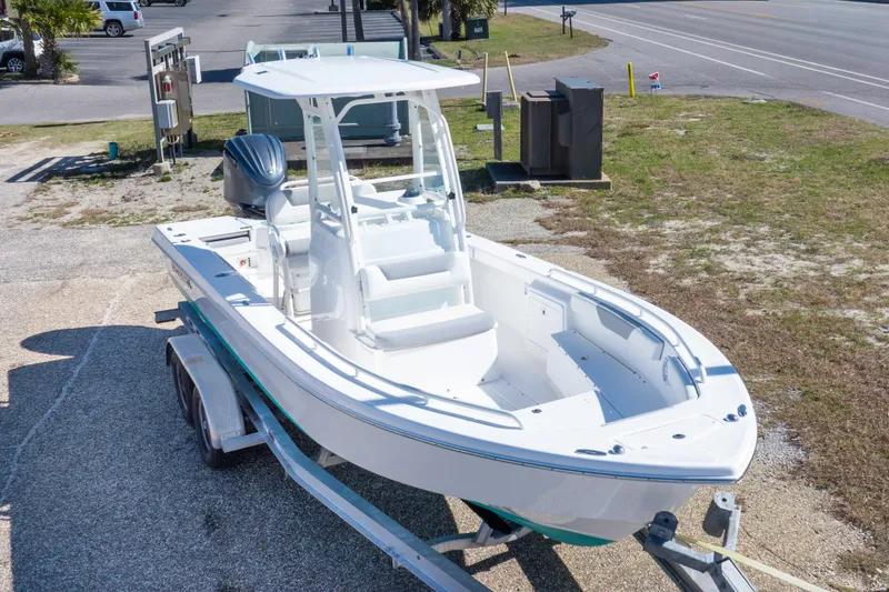 Slide: The Image of 2016 Everglades 243 Center Console boat on trailer, parked outdoors. - 25