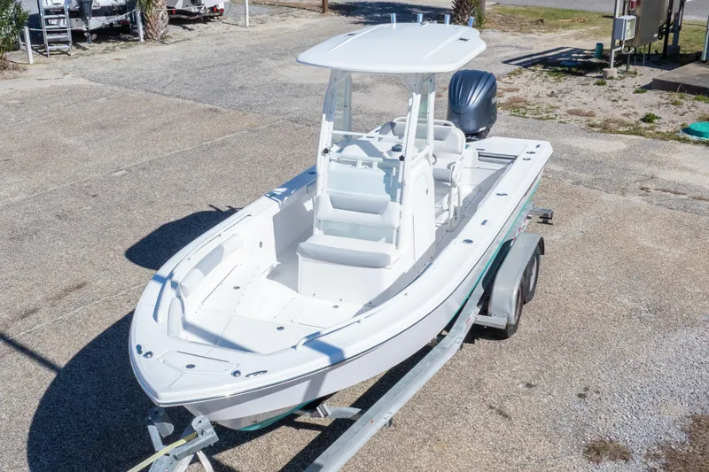 Slide: The Image of 2016 Everglades 243 Center Console boat on trailer, parked outdoors. - 26