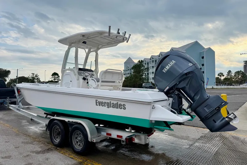 Slide: The Image of 2016 Everglades 243 Center Console boat on trailer with Yamaha engine, parked outdoors. - 33