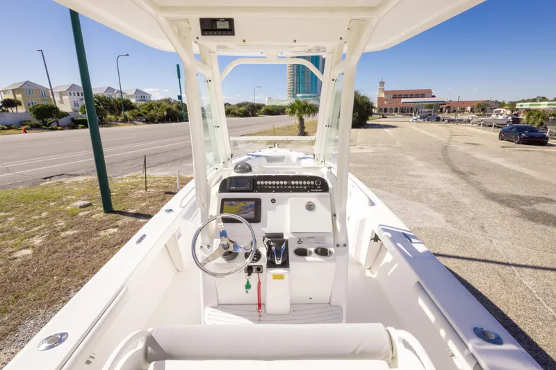 Slide: The Image of 2016 Everglades 243 Center Console boat on trailer, side view, clear blue sky. - 5