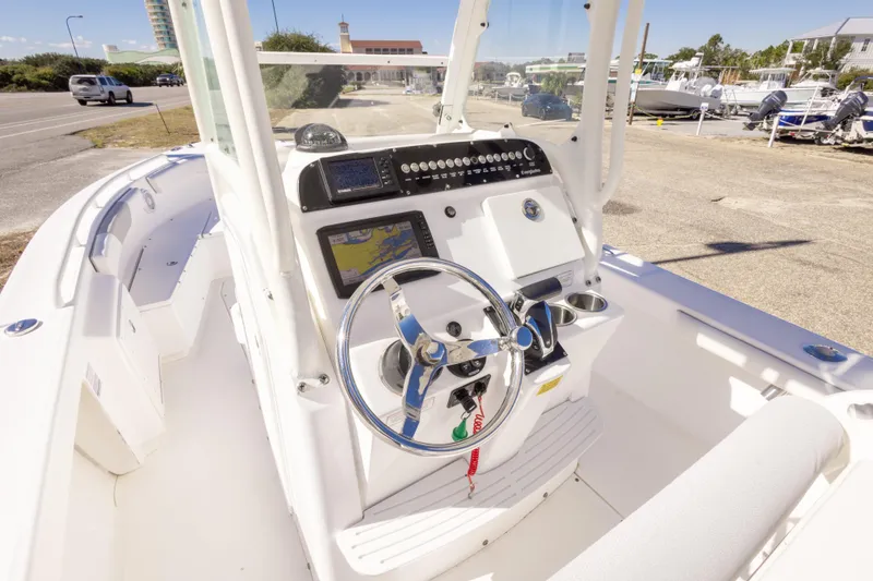 Slide: The Image of 2016 Everglades 243 Center Console boat on trailer under clear blue sky. - 6