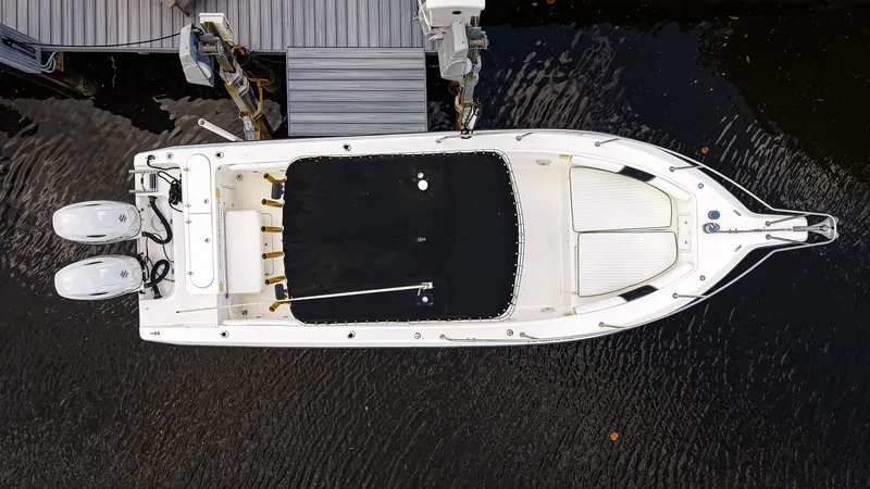 Slide: The Image of Overhead view of a 1999 Century 2600 CC boat docked on water. - 2