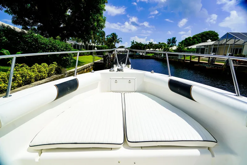 Slide: The Image of Century 2600 CC 1999 boat on a sunny canal, featuring white seating and lush surroundings. - 3